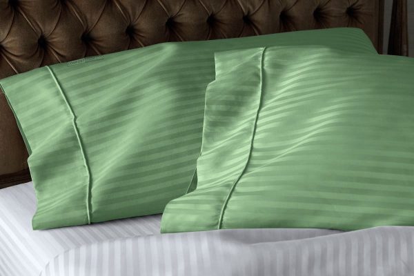 a pair of apple green pillowcases