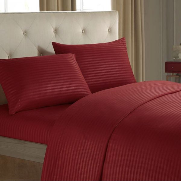 red bedsheet and pillows