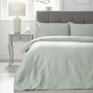 solid light green bedsheet and pillows