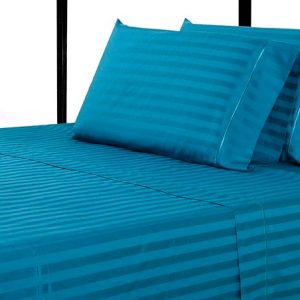 teal blue bedsheet and pillows
