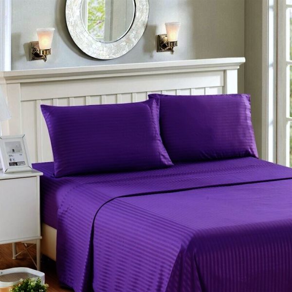 violet bedsheet and pillows