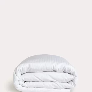 neatly folded white duvet