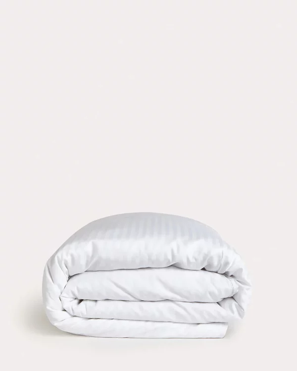 neatly folded white duvet