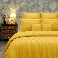 sunny yellow bedsheet and pillows