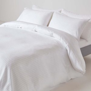 white bedsheet and pillows